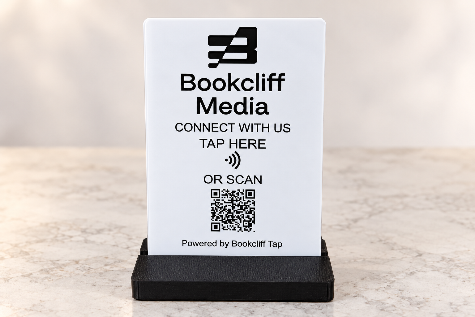 Bookcliff Tap acrylic counter sign in a black stand with tap and QR code instructions